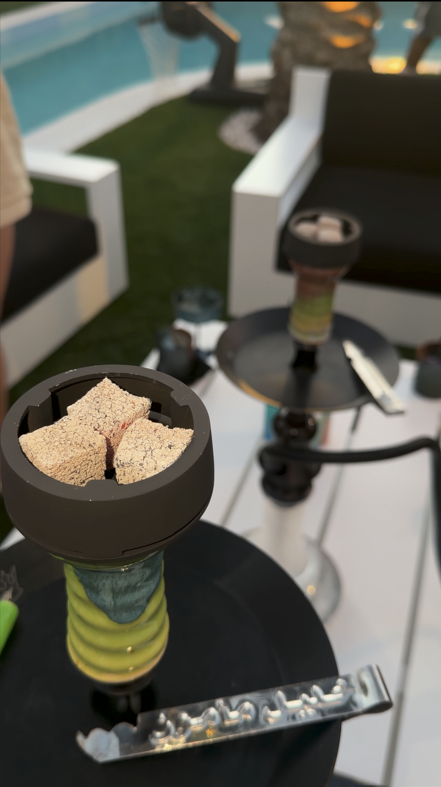 Poolside hookah bowl with fresh coals.