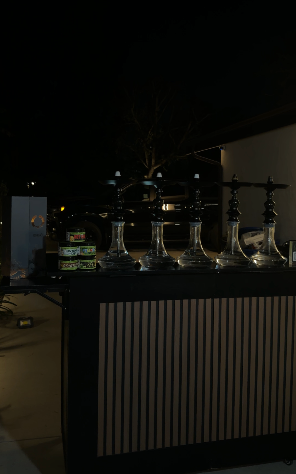 Element hookah bar setup at an evening event.