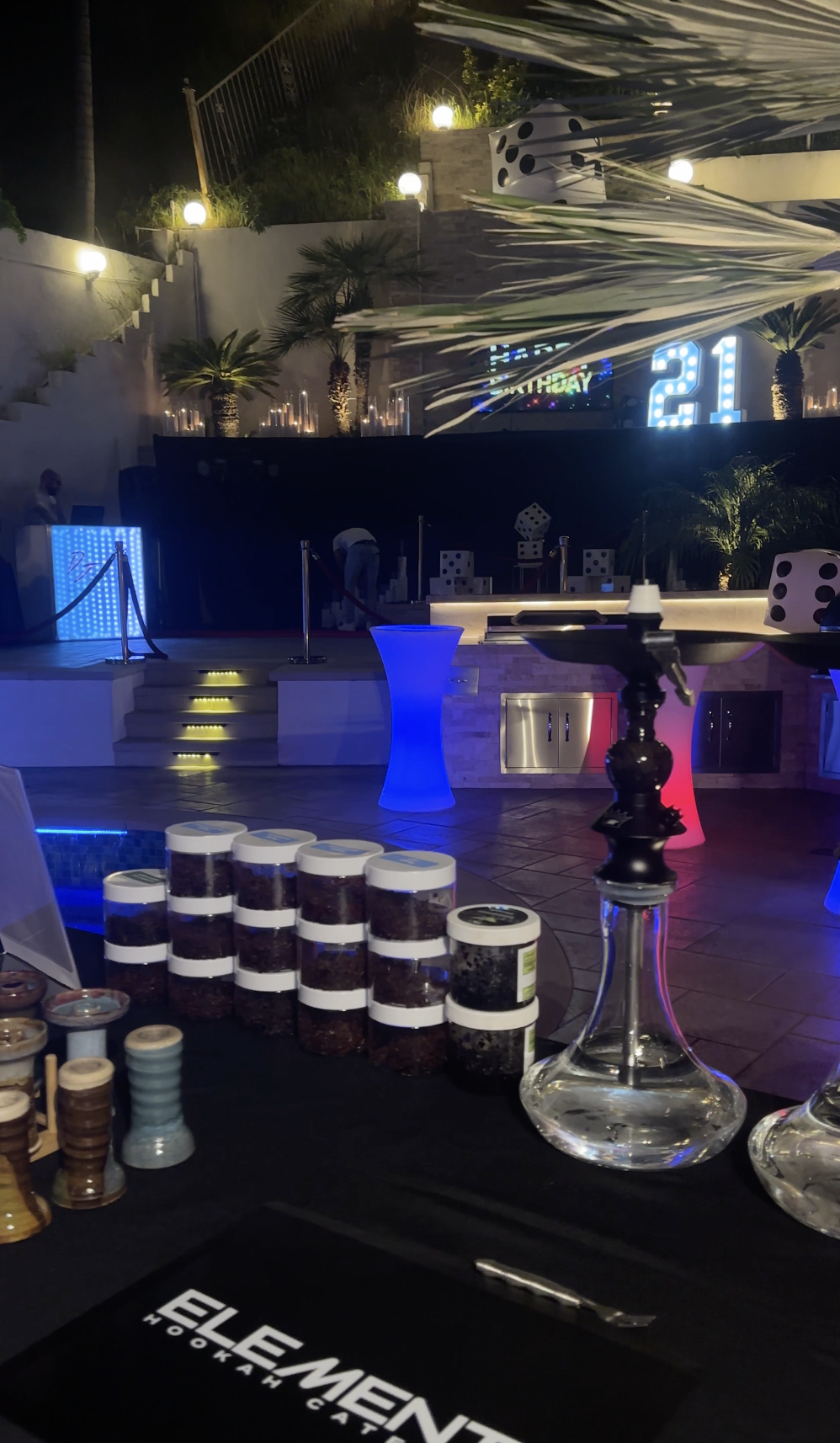 Element catering setup at a night event with LED signage.