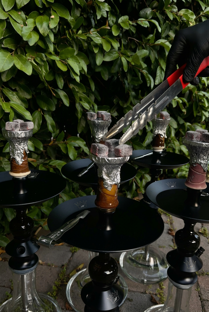 Freshly prepared hookah bowls with glowing coals outdoors.