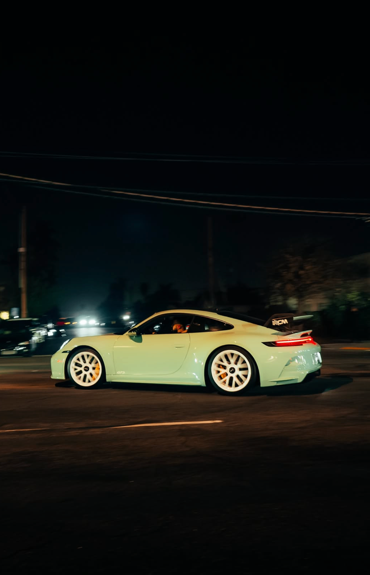 Porsche 911 GT3 on a night street.