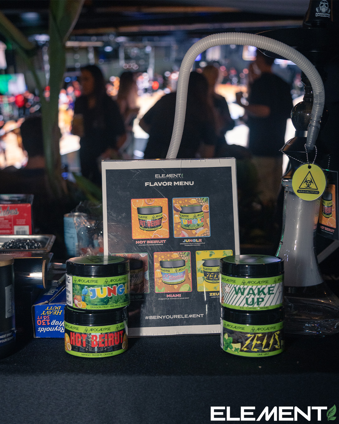 Element flavor menu with Apocalypse tobacco jars at a bar event.