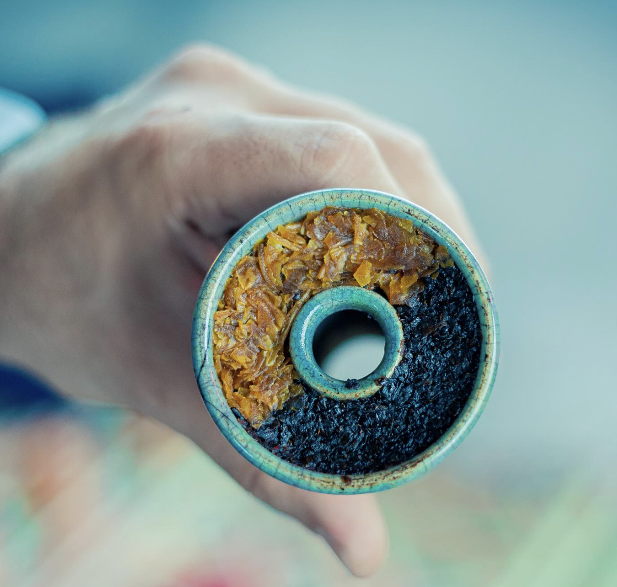 Close-up of a premium hookah bowl packed with two different tobacco blends.